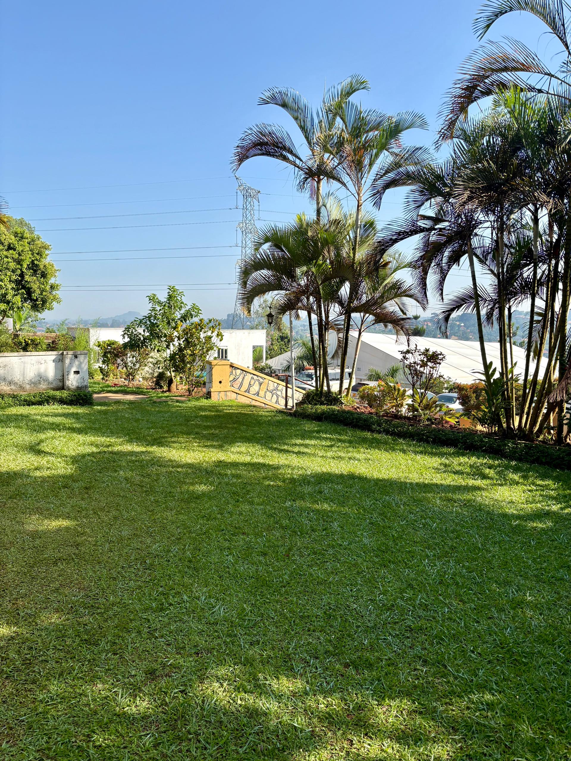 Lush garden grounds at Danma Gardens Hotel, Buloba, Uganda